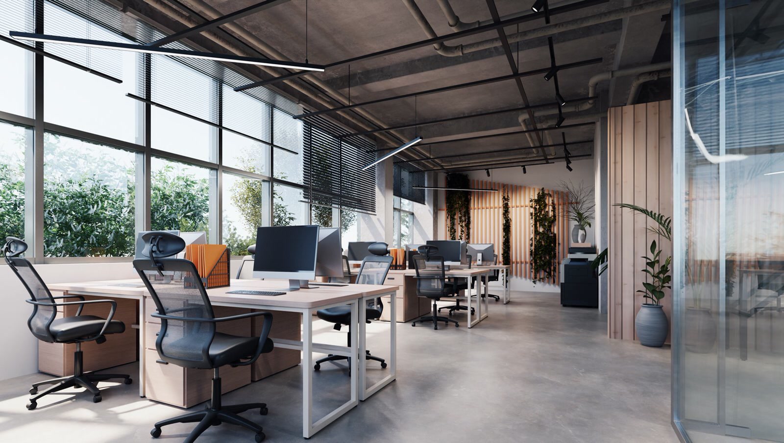 An open-plan office with desks clear and floors finished